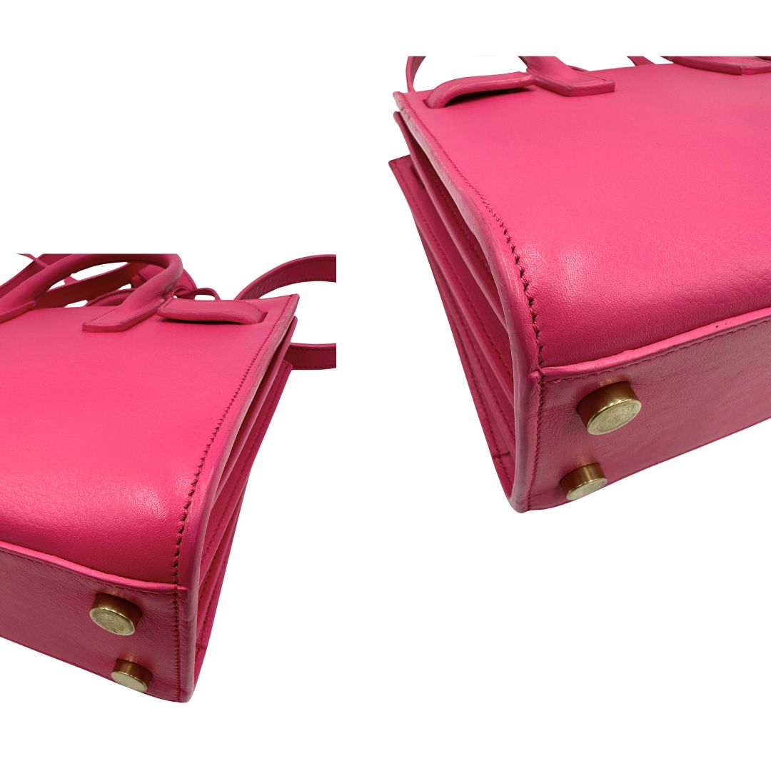 Sac De Jour nano Saint Laurent in pelle rosa babrie con doppi manici stondati e tracolla regolabile, e amovibile. Parti metalliche dorate. Originale, usato, condizioni ottime. 