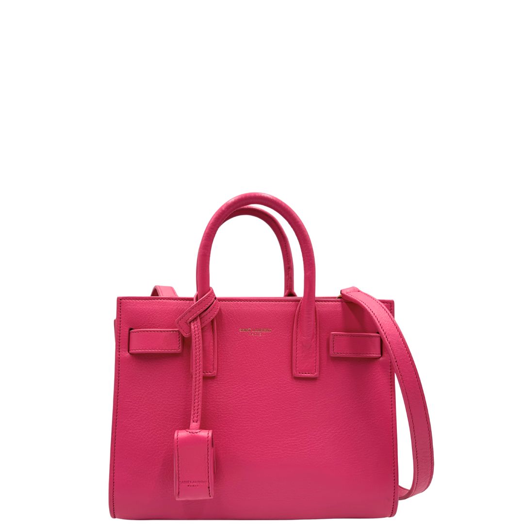 Sac De Jour nano Saint Laurent in pelle rosa babrie con doppi manici stondati e tracolla regolabile, e amovibile. Parti metalliche dorate. Originale, usato, condizioni ottime. 