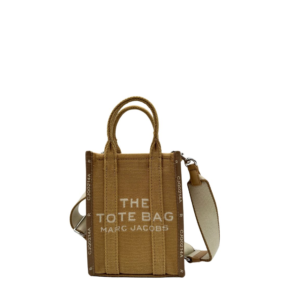 Front The Tote Bag Marc Jacobs in tessuto Jacquard con tracolla regolabile e amovibile in tessuto Bianco, rifinita con parti metalliche argentate.