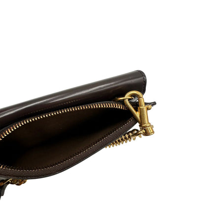 interno Borsa Tod's in pelle color testa di moro con parti metalliche dorate; munita di una tracolla in catena con spallaccio in pelle. Completa di dustbag, di lusso, originale, ottime condizioni. 