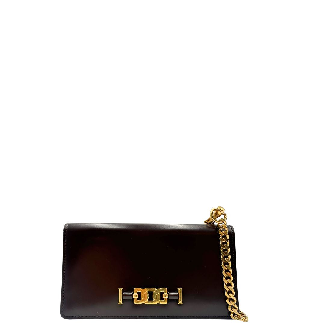 front Borsa Tod's in pelle color testa di moro con parti metalliche dorate; munita di una tracolla in catena con spallaccio in pelle. Completa di dustbag, di lusso, originale, ottime condizioni.