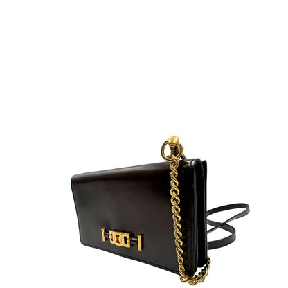 lato Borsa Tod's in pelle color testa di moro con parti metalliche dorate; munita di una tracolla in catena con spallaccio in pelle. Completa di dustbag, di lusso, originale, ottime condizioni. 