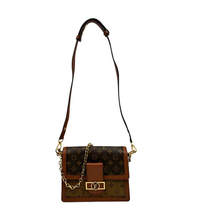  Borsa Dauphine MM Louis Vuitton in tela monogram, e monogram reverse bicolore con finiture in pelle cognac e parti metalliche dorate. Munita di una tracolla in pelle e un manico in catena, amovibili. Originale, usato, di lusso, in ottime condizioni 