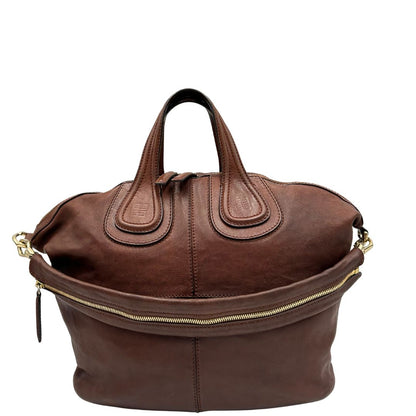 front Borsa Givenchy Nightingale in pelle marrone e parti metalliche dorate. Munita di doppi manici e tracolla una amovibile arricchita da una cerniera decorativa, di lusso, originale.
