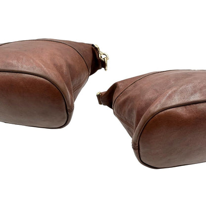 angoli Borsa Givenchy Nightingale in pelle marrone e parti metalliche dorate. Munita di doppi manici e tracolla una amovibile arricchita da una cerniera decorativa, di lusso, originale. 