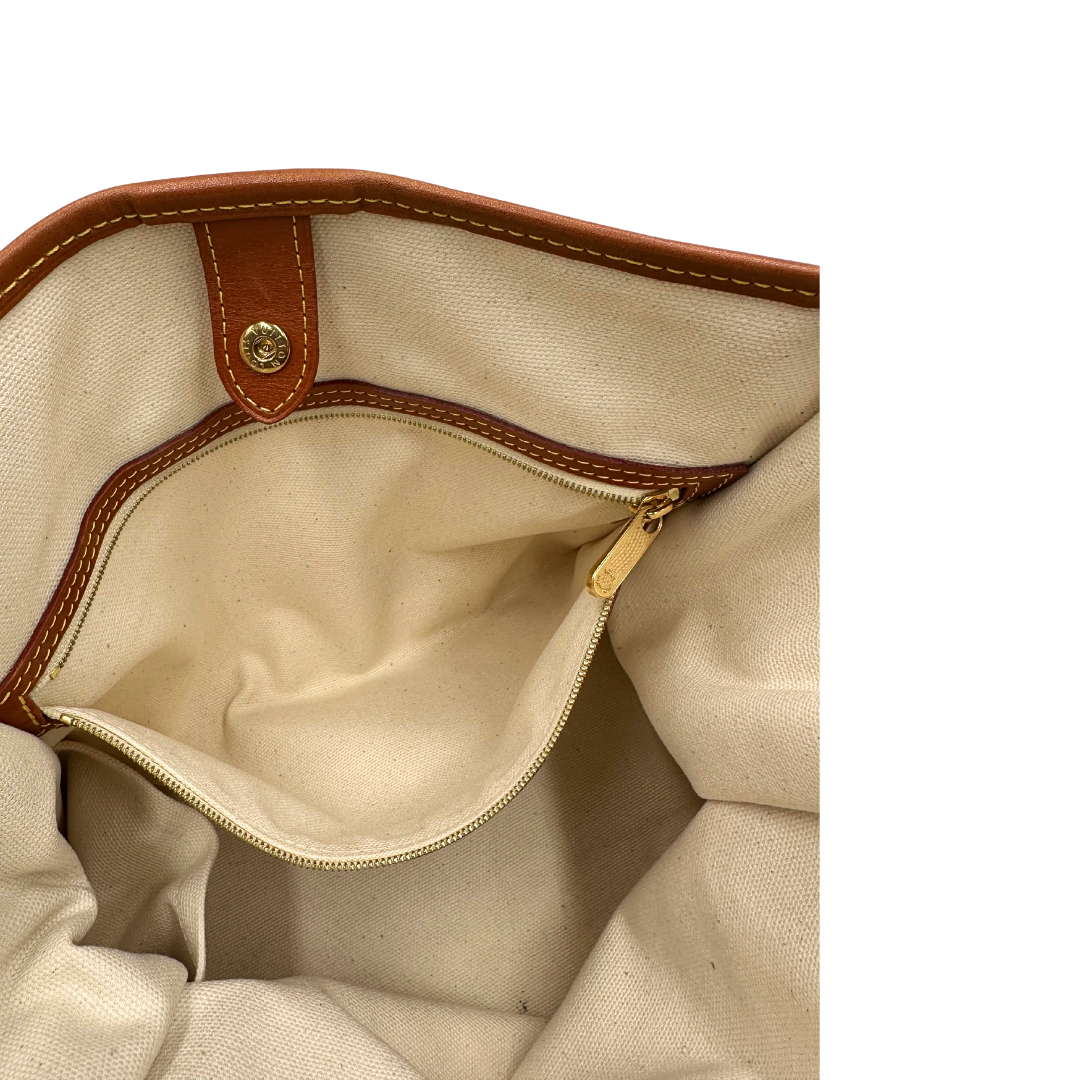 Tasca Borsa Louis Vuitton Tisse Rayures in tela monogram arricchita da finiture in pelle color cognac e crema con dettagli metalliche dorate; munita di due manici in pelle. Completa di scatola e dustbag. Originale, usata, di lusso, in ottime condizioni