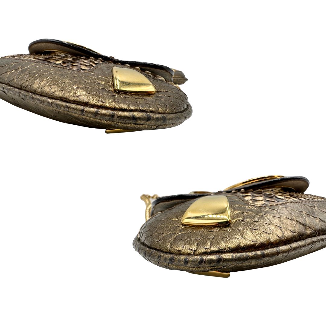 angoli Pochette Dolce & Gabbana sui toni caldi del marrone e del beige, trama animalier e parti metalliche dorate; munita di una mini pochette amovibile. Completa di dustbag, di lusso, originale, ottime condizioni, usata. 