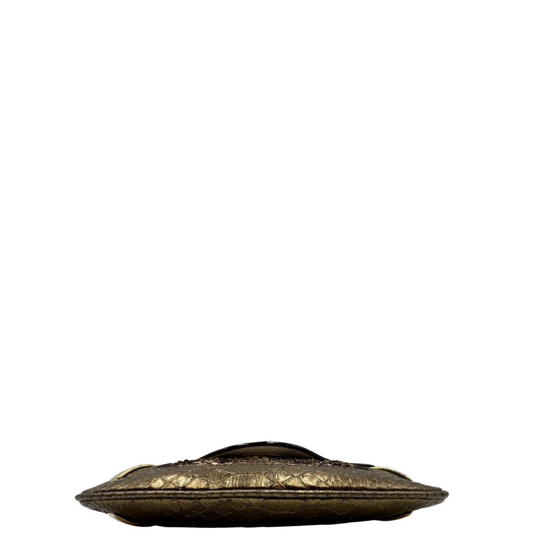 base Pochette Dolce & Gabbana sui toni caldi del marrone e del beige, trama animalier e parti metalliche dorate; munita di una mini pochette amovibile. Completa di dustbag, di lusso, originale, ottime condizioni, usata. 