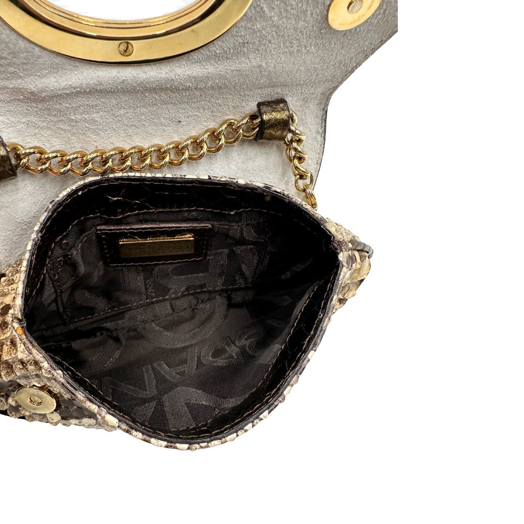 interno Pochette Dolce & Gabbana sui toni caldi del marrone e del beige, trama animalier e parti metalliche dorate; munita di una mini pochette amovibile. Completa di dustbag, di lusso, originale, ottime condizioni, usata. 