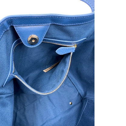 Tasca Borsa Burberry in canvas beige trama tartan rifinita con parti in pelle blu e impreziosita da stampa floreale; indossabile a spalla. Originale, usata, di lusso, in ottime condizioni
