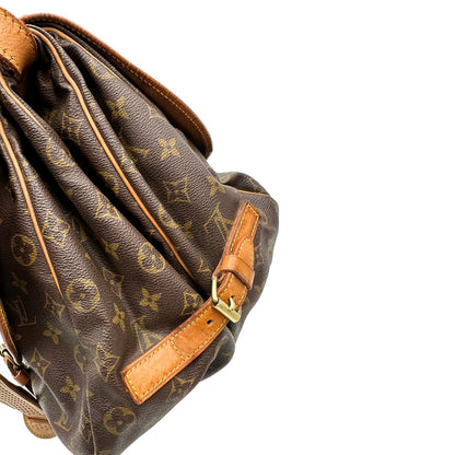 Borsa Saumur 35 Louis Vuitton in canvas marrone monogram con finiture in vacchetta naturale e parti metalliche dorate; da indossare a tracolla. Originale, usata, di lusso, in ottime condizioni