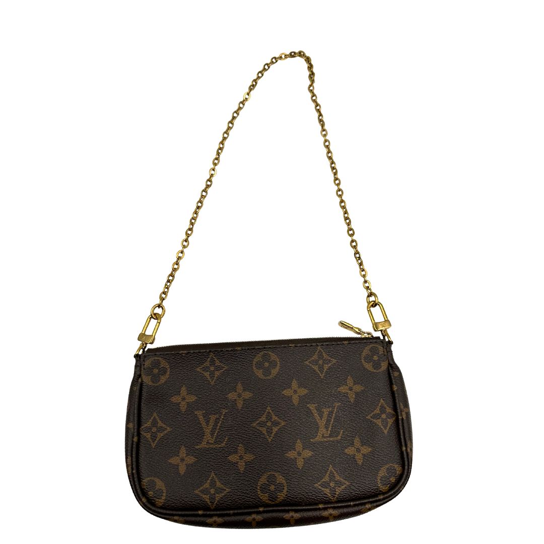 Iconica Multi Pochette Accessoires Louis Vuitton in canvas marrone monogram con dettagli in vacchetta naturale, manico in catena dorata e tracolla in tessuto Jacquard verde kaki. Dotata del classico mini portamonete rotondo, rimovibile. Originale, usata, di lusso, in ottime condizioni