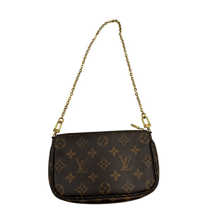 Iconica Multi Pochette Accessoires Louis Vuitton in canvas marrone monogram con dettagli in vacchetta naturale, manico in catena dorata e tracolla in tessuto Jacquard verde kaki. Dotata del classico mini portamonete rotondo, rimovibile. Originale, usata, di lusso, in ottime condizioni