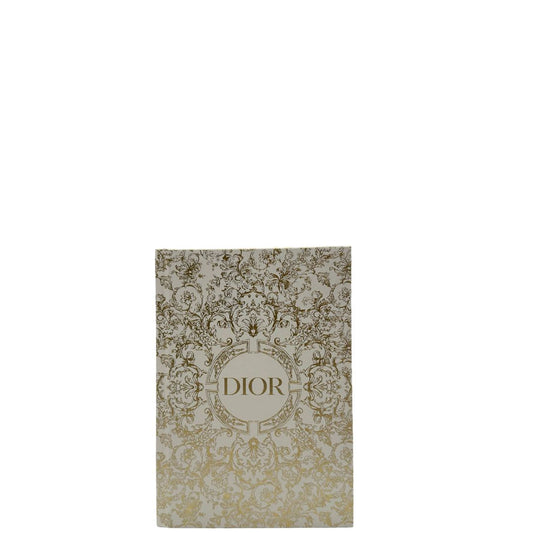 Agenda Dior con copertina rigida bianca con stampa raffinata Folreale dorata e logo ''Dior'' centrale. Originale, usata, di lusso, in condizioni eccellenti.