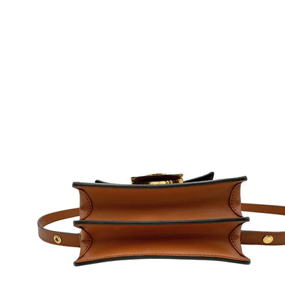 Base di una Borsa Dauphine Mini Louis Vuitton in tela monogram, e monogram reverse bicolore con finiture in pelle cognac e parti metalliche dorate, munita di una tracolla in pelle allungabile e un manico in catena, amovibili. Originale, usata, di lusso, in ottime condizioni