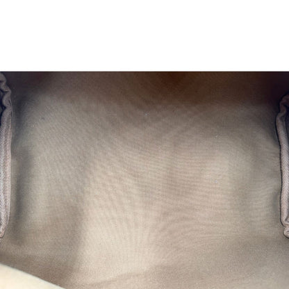 Interno di una Borsa Montorgueil Louis Vuitton in canvas marrone monogram con finiture in vacchetta naturale e parti metalliche dorate; da indossare a spalla. Originale, usata, di lusso, in ottime condizioni.