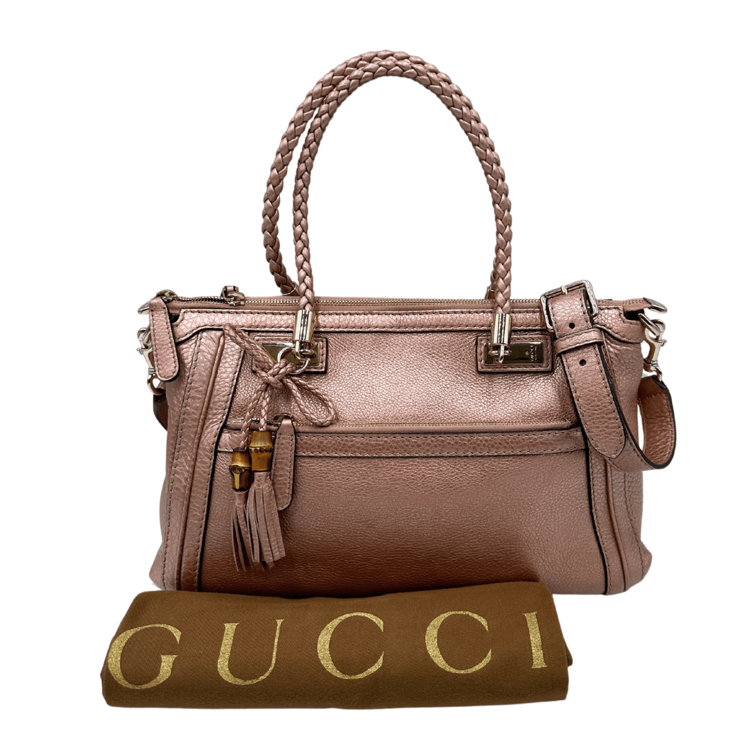 Borsa Gucci bamboo in pelle laminata rosa e manici intrecciati. Borsa usata originale di lusso