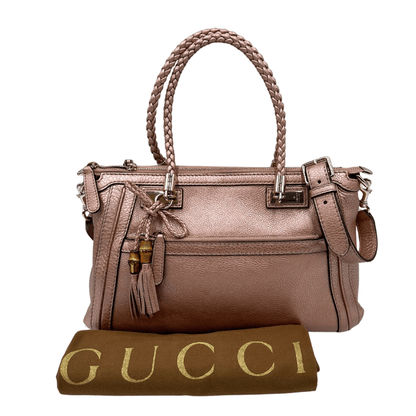 Borsa Gucci bamboo in pelle laminata rosa e manici intrecciati. Borsa usata originale di lusso