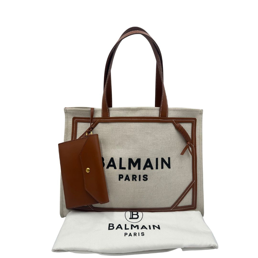 dustbag Borsa Balmain in tessuto color sabbia rifinita con parti in pelle marroni; munita di doppi manici e una pochette estraibile 