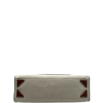 base Borsa Balmain in tessuto color sabbia rifinita con parti in pelle marroni; munita di doppi manici e una pochette estraibile 