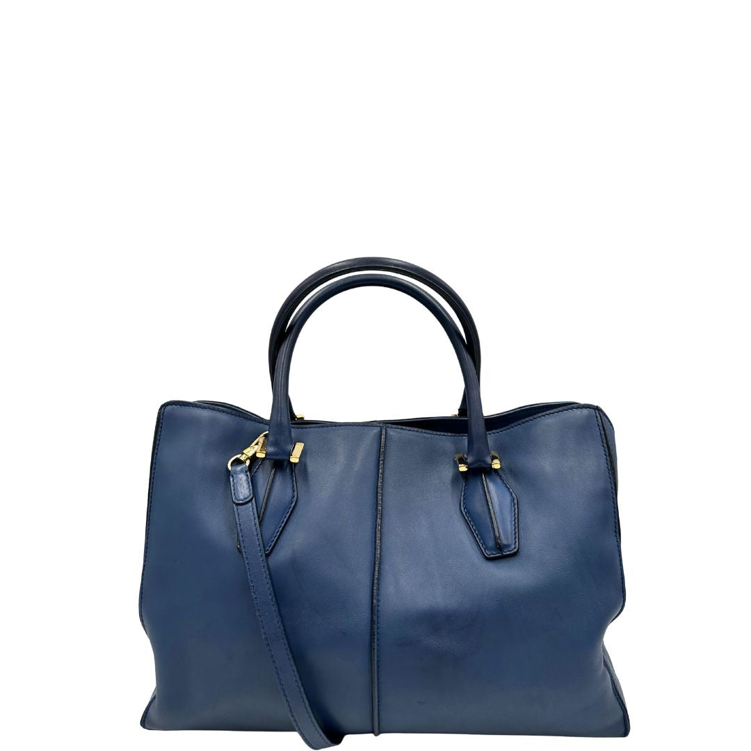 front Bauletto Tod's in pelle blu con parti metalliche dorate; munita di doppi manici stondati e una tracolla amovibile e regolabile 