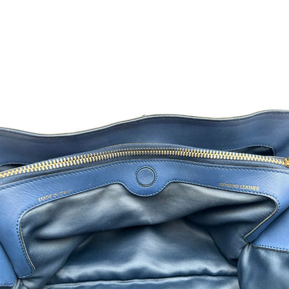 interno Bauletto Tod's in pelle blu con parti metalliche dorate; munita di doppi manici stondati e una tracolla amovibile e regolabile