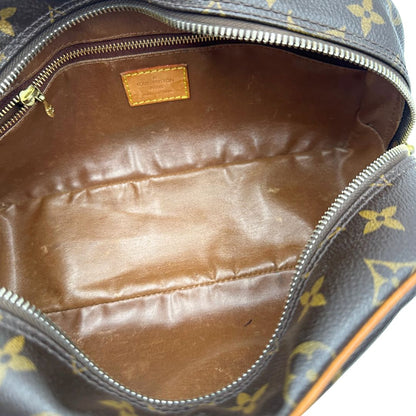  trousse in canvas marrone monogram con finiture in vacchetta naturale e parti metalliche dorate.