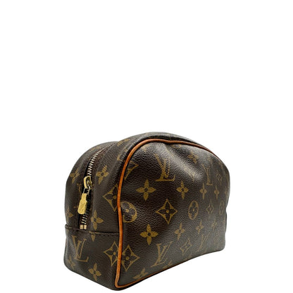 lato  trousse in canvas marrone monogram con finiture in vacchetta naturale e parti metalliche dorate.