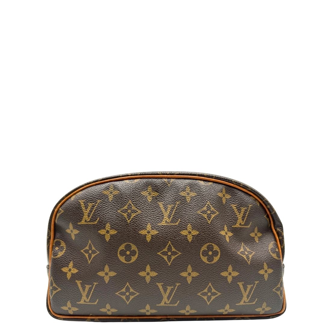  trousse in canvas marrone monogram con finiture in vacchetta naturale e parti metalliche dorate.