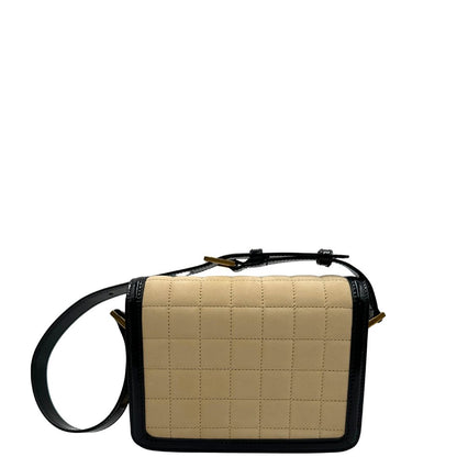 retro Borsa Saint Laurent in pelle nabuk beige e pelle lucida nera con parti metalliche dorate, impreziosita da iconico logo Cassandre sul front; munita di un manico regolabile. Completa di corredo.