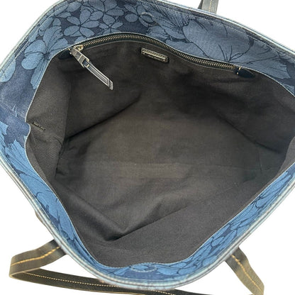 interno  Borsa Miu Miu in canvas sui toni del blu con trama floreale e parti metalliche argentate; munita di doppi manici. Completa di dustbag, di lusso, originale, usata. 