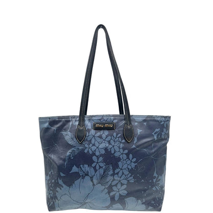front   Borsa Miu Miu in canvas sui toni del blu con trama floreale e parti metalliche argentate; munita di doppi manici. Completa di dustbag, di lusso, originale, usata.