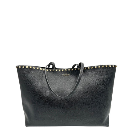 Borsa Valentino Garavani in pelle nera con parti metalliche dorate, impreziosita da borchie piramidali sulle finiture superiori; munita di doppi manici, di lusso, originale, ottimo stato.