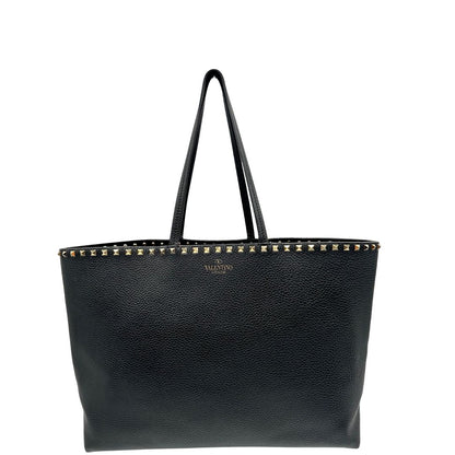 front Borsa Valentino Garavani in pelle nera con parti metalliche dorate, impreziosita da borchie piramidali sulle finiture superiori; munita di doppi manici, di lusso, originale, ottimo stato. 