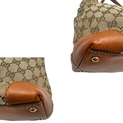 angoli Borsa Gucci in tessuto GG monogram con finiture in pelle marroni e parti metalliche dorate; munita di doppi manici, da portare a spalla, di lusso, originale, ottime condizioni. 