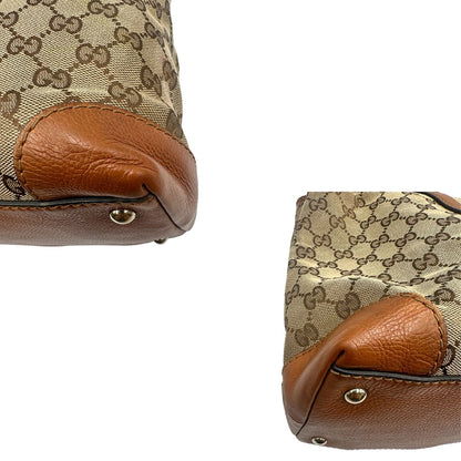 angoli Borsa Gucci in tessuto GG monogram con finiture in pelle marroni e parti metalliche dorate; munita di doppi manici, da portare a spalla, di lusso, originale, ottime condizioni. 