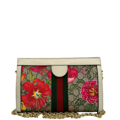 retro Borsa Gucci in canvas GG con trama floreale, finiture in pelle bianche e parti metalliche dorate; munita di una tracolla in catena. Completa di dustbag, di lusso, originale, usata.