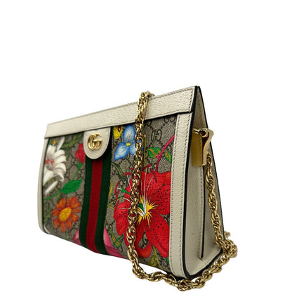 lato Borsa Gucci in canvas GG con trama floreale, finiture in pelle bianche e parti metalliche dorate; munita di una tracolla in catena. Completa di dustbag, di lusso, originale, usata. 