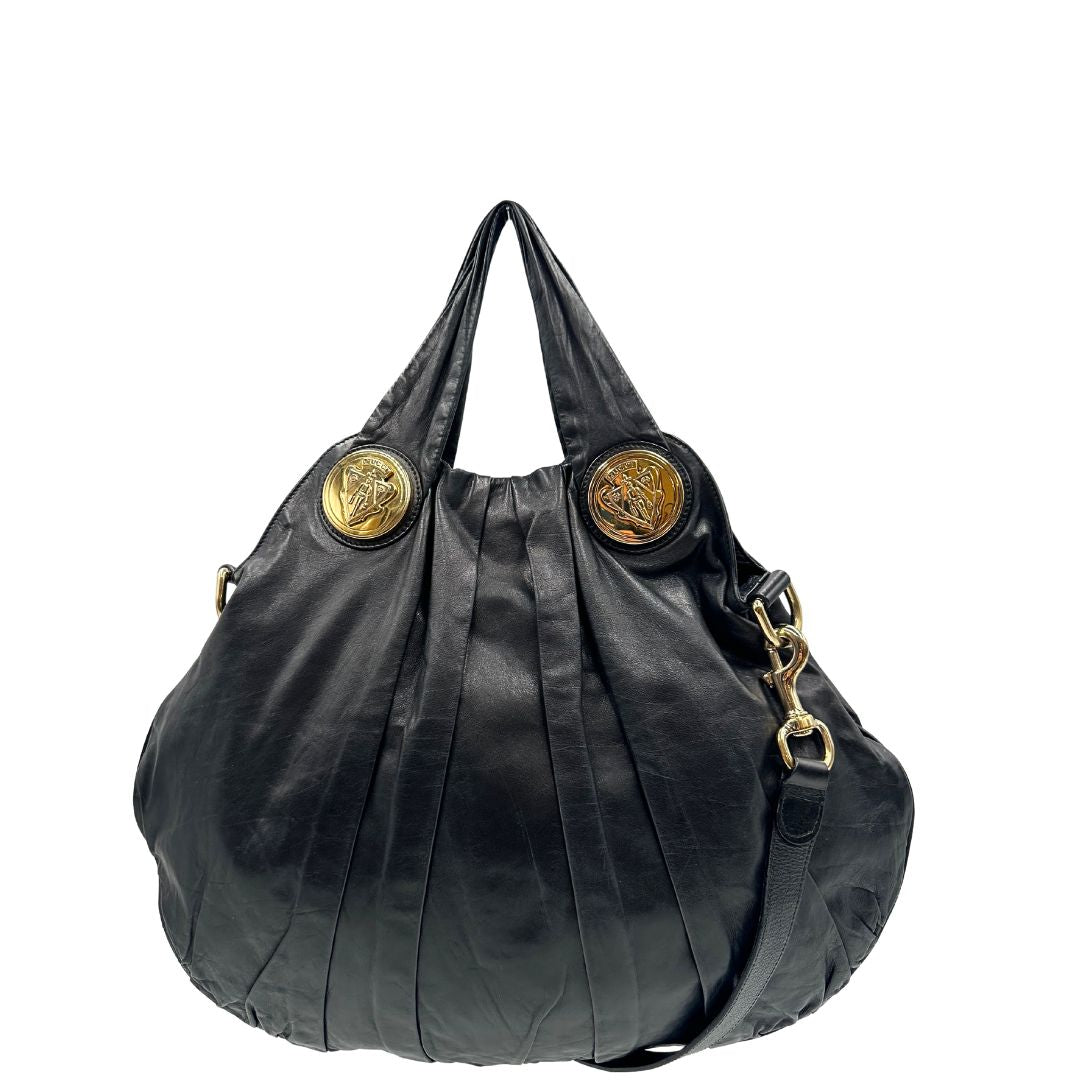 front  Borsa Gucci in pelle nera con parti metalliche dorate; munita di doppi manici e una tracolla amovibile. Completa di dustbag, di lusso, originale, ottime condizioni. 