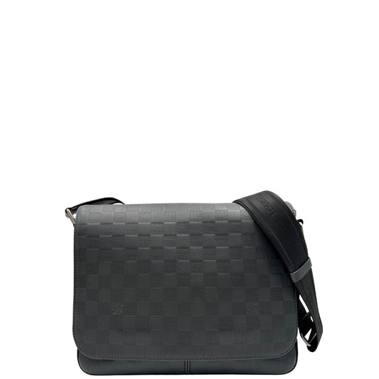 front Borsa messenger in canvas nero e parti metalliche argento opaco; munita di una tracolla in tessuto regolabile. Completa di corredo, di lusso, originale, ottime condizioni. 