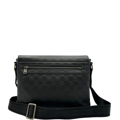 retro Borsa messenger in canvas nero e parti metalliche argento opaco; munita di una tracolla in tessuto regolabile. Completa di corredo, di lusso, originale, ottime condizioni. 