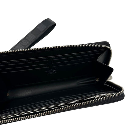 interno Portafoglio Louis Vuitton in canvas Damier Graphite con parti metalliche argentate; munito di un polsino. Completo di corredo, di lusso, originale, ottime condizioni. 