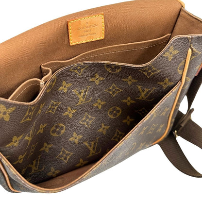 interno Borsa Messenger Bosphore Louis Vuitton in canvas marrone monogram con finiture in vacchetta naturale, tracolla in tessuto regolabile e parti metalliche dorate, di lusso, originale, usata. 