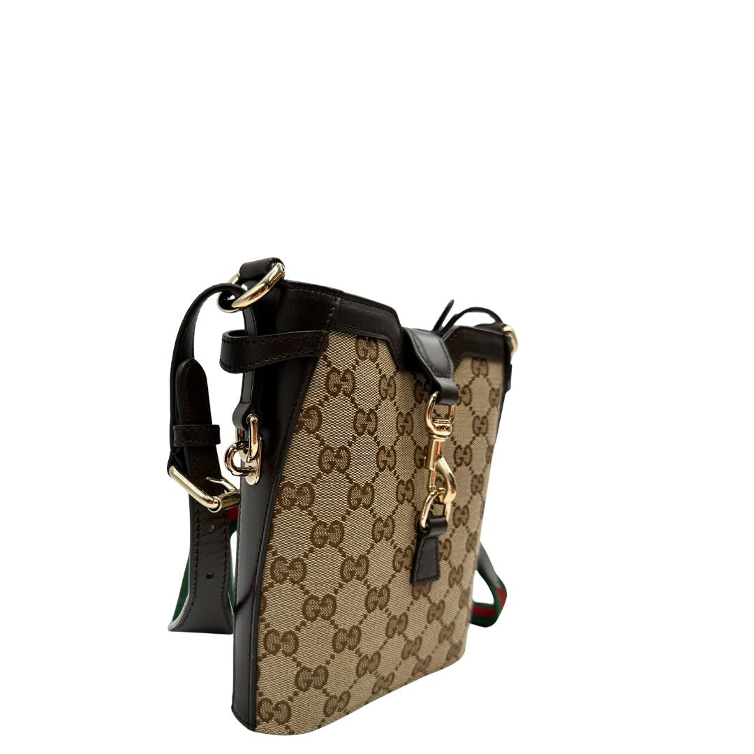 Laterali Borsa Gucci in tessuto GG monogram beige con finiture in pelle marroni testa di moro e parti metalliche dorate, munita di una tracolla in tessuto Web verde e rosso. Completa di dustbag. Originale, usata, di lusso, in ottime condizioni