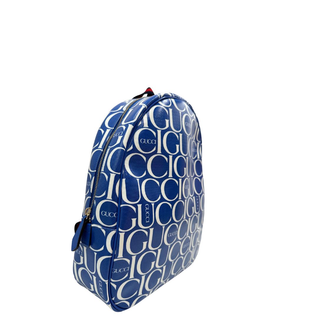 Laterali Zaino Gucci in canvas blu e bianco monogram con parti metalliche dorate; munito di un manico e doppie bretelle con iconica trama Web blu e rossa. Completo di dustbag. Originale, usata, di lusso, in condizioni eccellenti.