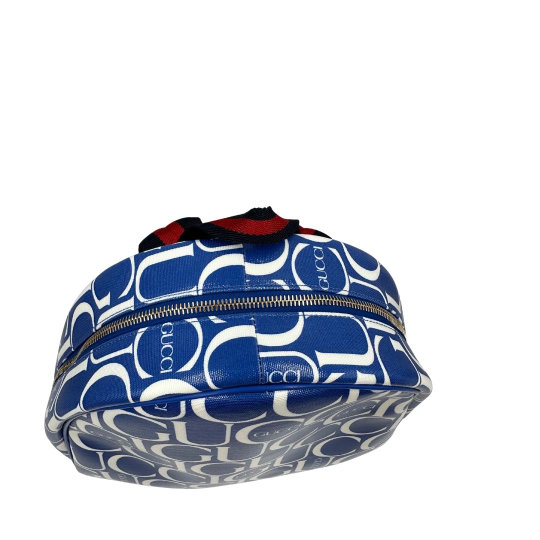 Manico  Zaino Gucci in canvas blu e bianco monogram con parti metalliche dorate; munito di un manico e doppie bretelle con iconica trama Web blu e rossa. Completo di dustbag. Originale, usata, di lusso, in condizioni eccellenti.