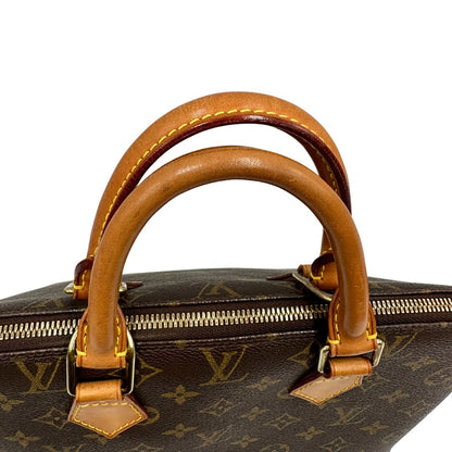 manici Borsa Louis Vuitton in canvas marrone monogram con finiture in vacchetta naturale e parti metalliche dorate; munita di doppi manici stondati, da portare a mano. Completa di chiavi e lucchetto, di lusso, originale, ottime condizioni. 