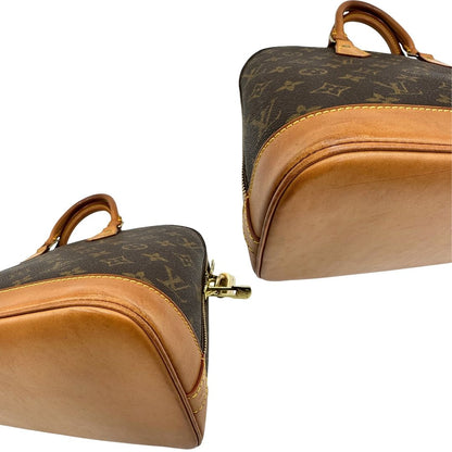 angoli Borsa Louis Vuitton in canvas marrone monogram con finiture in vacchetta naturale e parti metalliche dorate; munita di doppi manici stondati, da portare a mano. Completa di chiavi e lucchetto, di lusso, originale, ottime condizioni. 