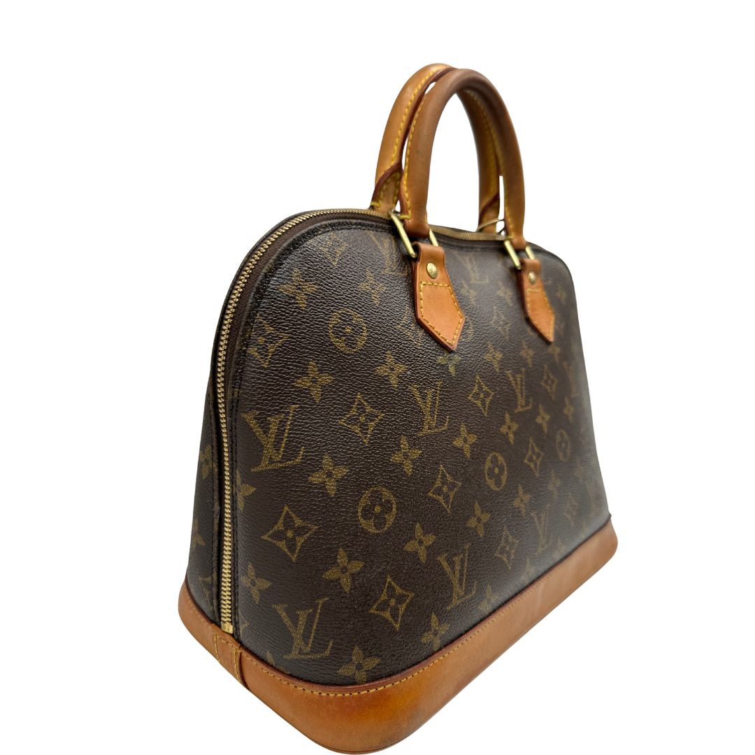 lato  Borsa Louis Vuitton in canvas marrone monogram con finiture in vacchetta naturale e parti metalliche dorate; munita di doppi manici stondati, da portare a mano, di lusso, originale, ottime condizioni. 