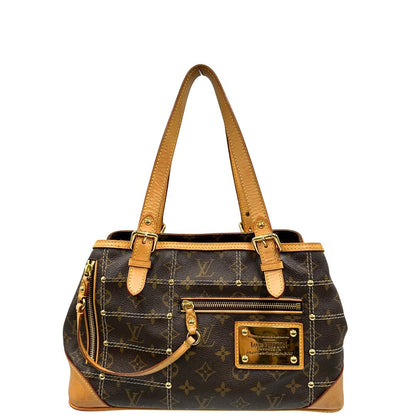 Front di una borsa Louis Vuitton in canvas marrone monogram con cuciture decorative e finiture in vacchetta naturale. Parti metalliche dorate; munita di doppi manici, indossabile a spalla.